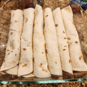 tortillas in a square casserole dish